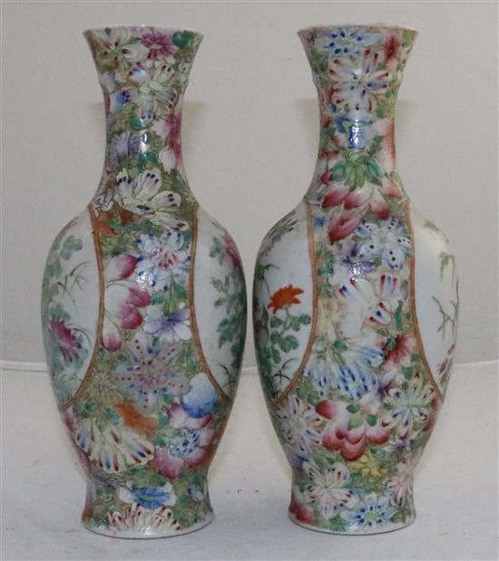 A pair of Chinese famille rose millefleur bottle vases, early 20th century, 24.5cm